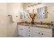Bright bathroom featuring a double vanity with granite countertops, providing ample space and style at 31013 N Claridge Cir, San Tan Valley, AZ 85143