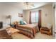 Cozy bedroom with natural light, desk, and a comfortable bed, creating a peaceful and functional space at 31013 N Claridge Cir, San Tan Valley, AZ 85143