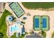 An aerial of community pool, playground, tennis courts, and lake with fountain at 31013 N Claridge Cir, San Tan Valley, AZ 85143