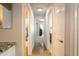 Hallway offers bathroom and bedroom access with tile floors and neutral walls at 31013 N Claridge Cir, San Tan Valley, AZ 85143
