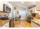 Bright kitchen featuring granite countertops, stainless steel appliances, and a breakfast nook with views from the window at 31013 N Claridge Cir, San Tan Valley, AZ 85143