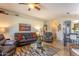 An open concept living room with vaulted ceilings, comfortable furnishings, and lots of natural light at 31013 N Claridge Cir, San Tan Valley, AZ 85143