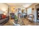 Bright living room features tile flooring, an open floor plan, comfortable seating, and backyard views at 31013 N Claridge Cir, San Tan Valley, AZ 85143