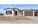 Beautiful single-story home with a stone facade and a two-car garage at 37650 W Nina St, Maricopa, AZ 85138