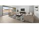 Bright living room featuring neutral tones, a large window, stylish furniture, and a modern rug at 37650 W Nina St, Maricopa, AZ 85138