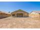 This property features a spacious backyard with a covered patio and block fence at 3805 S 73Rd Dr, Phoenix, AZ 85043
