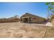 Spacious backyard featuring a covered patio, block fence, and ample space for outdoor activities at 3805 S 73Rd Dr, Phoenix, AZ 85043