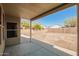 Spacious backyard with a covered patio, block wall fencing, and open space at 3805 S 73Rd Dr, Phoenix, AZ 85043