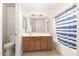 Traditional bathroom with wood vanity, tile countertop and flooring, and shower-tub combination at 3805 S 73Rd Dr, Phoenix, AZ 85043