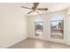 Bedroom with dual arched windows offering abundant natural light and tile floors at 3805 S 73Rd Dr, Phoenix, AZ 85043