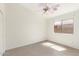 Cozy bedroom with natural light, a ceiling fan, and tile floors at 3805 S 73Rd Dr, Phoenix, AZ 85043