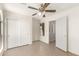 Bedroom with sliding closet, door leading to another room, and large windows at 3805 S 73Rd Dr, Phoenix, AZ 85043