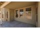 Covered patio with multiple windows, a door to backyard, offering a nice outdoor living space at 3805 S 73Rd Dr, Phoenix, AZ 85043