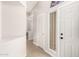 Bright entryway with light tile flooring, white walls, and view into the hall at 3805 S 73Rd Dr, Phoenix, AZ 85043