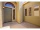 Inviting entryway with unique glass window accent, neutral paint, and simple design at 3805 S 73Rd Dr, Phoenix, AZ 85043