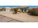 Attractive single-story home featuring a tile roof, low maintenance desert landscaping, and clean exterior at 3805 S 73Rd Dr, Phoenix, AZ 85043