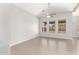 Bright and open living room with tile flooring, large windows, and ceiling fan at 3805 S 73Rd Dr, Phoenix, AZ 85043