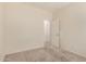 Neutral bedroom with carpet flooring, and open doorway to another room at 41444 W Capistrano Dr, Maricopa, AZ 85138