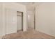 Neutral bedroom with closet space and carpet flooring at 41444 W Capistrano Dr, Maricopa, AZ 85138