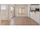Open dining area with tile flooring, natural light, and access to the backyard at 41444 W Capistrano Dr, Maricopa, AZ 85138