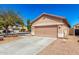 Single-story home featuring desert landscaping, a two-car garage, and a concrete driveway at 41444 W Capistrano Dr, Maricopa, AZ 85138