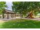 Community playground with covered picnic benches, a slide, and swings for a fun outdoor experience at 41444 W Capistrano Dr, Maricopa, AZ 85138