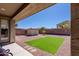 Backyard featuring desert landscaping, artificial turf, and a storage shed at 4557 W South Butte Rd, San Tan Valley, AZ 85144