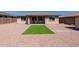 This home features a low maintenance backyard with artificial turf and a rock ground cover at 4557 W South Butte Rd, San Tan Valley, AZ 85144