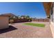 This home features a low maintenance backyard with artificial turf and a rock ground cover at 4557 W South Butte Rd, San Tan Valley, AZ 85144