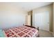 Spacious bedroom featuring neutral walls, carpet flooring, and a double door closet at 4557 W South Butte Rd, San Tan Valley, AZ 85144