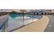 A community pool offers a fun splash pad for young children and shade to relax at 4557 W South Butte Rd, San Tan Valley, AZ 85144