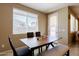 Dining room with a wood table, modern chairs, bench seating and lots of natural light at 4557 W South Butte Rd, San Tan Valley, AZ 85144