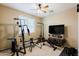 Neutral tone exercise room featuring free weights, weight machine, and carpet flooring at 4557 W South Butte Rd, San Tan Valley, AZ 85144