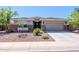 Charming single-story home with a two-car garage and low-maintenance desert landscaping at 4557 W South Butte Rd, San Tan Valley, AZ 85144