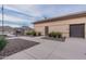 Exterior building view showing a gated entrance, sidewalks and desert landscaping at 4557 W South Butte Rd, San Tan Valley, AZ 85144