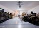 Spacious garage with ample storage and a work area at 4557 W South Butte Rd, San Tan Valley, AZ 85144