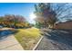 Landscaped walking area with green space and mature trees at 4557 W South Butte Rd, San Tan Valley, AZ 85144