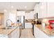 Bright kitchen with white cabinets, stainless steel appliances, and granite countertops at 4557 W South Butte Rd, San Tan Valley, AZ 85144