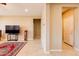 Open living room with tile floors and large speakers set atop beautiful area rug at 4557 W South Butte Rd, San Tan Valley, AZ 85144