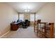 Spacious home office featuring neutral walls, carpet flooring, and a chandelier at 4557 W South Butte Rd, San Tan Valley, AZ 85144