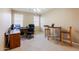 Comfortable home office featuring neutral walls, carpet flooring, and a chandelier at 4557 W South Butte Rd, San Tan Valley, AZ 85144
