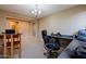 Cozy home office featuring neutral walls, carpet flooring, and a chandelier at 4557 W South Butte Rd, San Tan Valley, AZ 85144