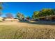 A community park with grassy areas, a playground, a picnic shelter, and walking path at 4557 W South Butte Rd, San Tan Valley, AZ 85144