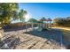 The community playground, featuring shade from trees and a picnic shelter, is ready for fun at 4557 W South Butte Rd, San Tan Valley, AZ 85144