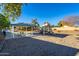 Community playground with green picnic table and shelter providing fun for all ages at 4557 W South Butte Rd, San Tan Valley, AZ 85144