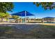 Community playground area with slides and covered picnic benches at 4557 W South Butte Rd, San Tan Valley, AZ 85144