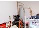 Utility area featuring a water heater and space for storage at 4557 W South Butte Rd, San Tan Valley, AZ 85144