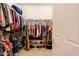 Spacious walk-in closet with double doors and ample shelving and hanging storage at 4557 W South Butte Rd, San Tan Valley, AZ 85144