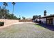 Large backyard featuring a gravel area and block wall for privacy at 4902 E Charter Oak Rd, Scottsdale, AZ 85254