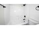 Bathroom with a white shower and bathtub combination, a black shower head and fixture, with toilet nearby at 4902 E Charter Oak Rd, Scottsdale, AZ 85254